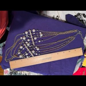 Multi strand pearls and gold necklace